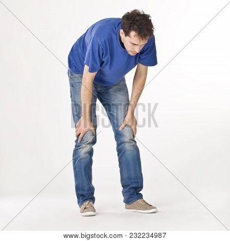 Man In Blue T-shirt Feeling Tired. Square.
