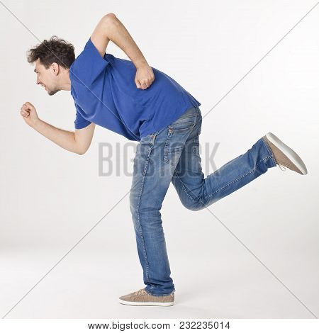 Portrait Of Joyful Running Man In Blue T-shirt