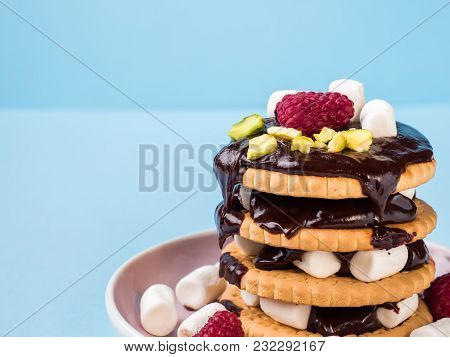 A Sweet Dessert Of A Chocolate Cookie Raspberry And Marshmallow Cup Of Coffee On A Light Blue Table