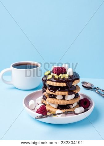 A Sweet Dessert Of A Chocolate Cookie Raspberry And Marshmallow Cup Of Coffee On A Light Table.