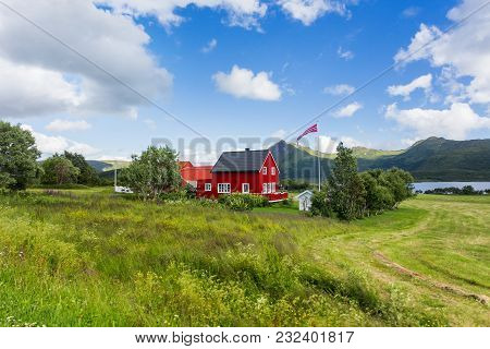 Typical Scandinavian Landscape With Meadows, Mountains And Village. Lofoten Islands, Norway.
