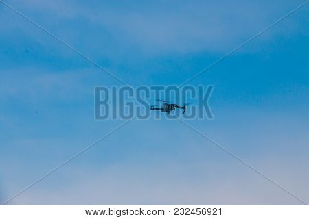 The Modern Drone On The Background Of Bright Blue Sky