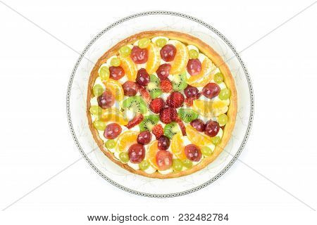 Top View Of A Fresh Homemade Multi-fruit Tart Cake On A Plate And Isolated On A White Background.