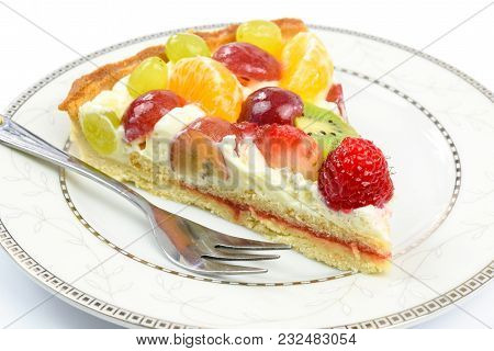 Fresh Homemade Multi Fruit Tart Cake On A Plate In Close-up.