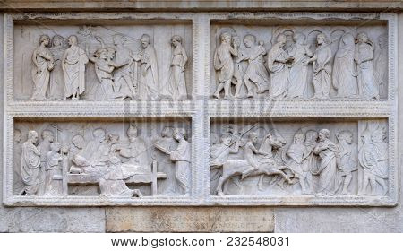 MODENA, ITALY - JUNE 04: Panel with episodes of the life of St. Geminiano, by Agostino di Duccio of about 1442, Modena Cathedral, Italy on June 04, 2017.