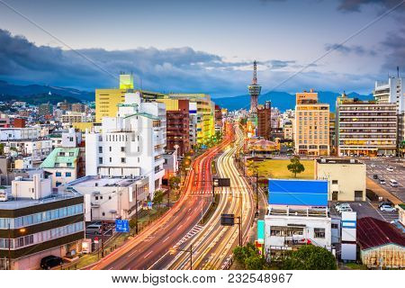 Beppu, Japan downtown city skyline at dusk.