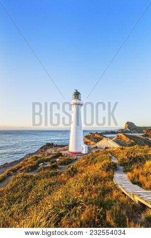 Castlepoint Lighthouse, Wairarapa, New Zealand At Sunrise