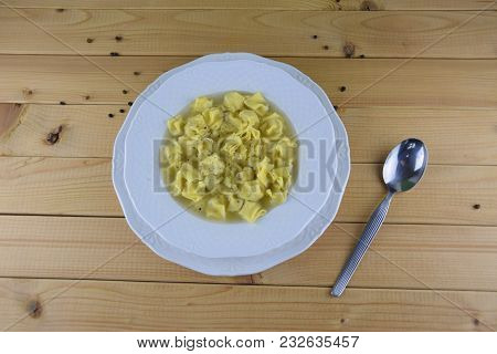 Hot Fresh Pasta, Fagottini, With Meat Broth And Black Pepper On The Wooden Table, Background, Copysp