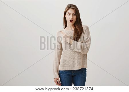 Woman Is Gossiping About Coworker, Being Shocked With Her Inappropriate Outfit. Studio Shot Of Good-