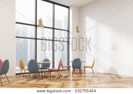 White Wall Loft Cafe Corner With A Wooden Floor, Round Tables And Pastal Colors Chairs. 3d Rendering