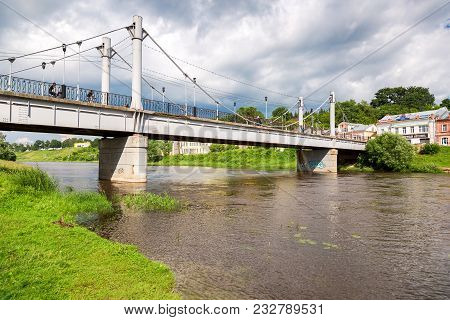 Torzhok, Russia - July 16, 2017: Pedestrian Bridge Across The Tvertsa River In Summer Day