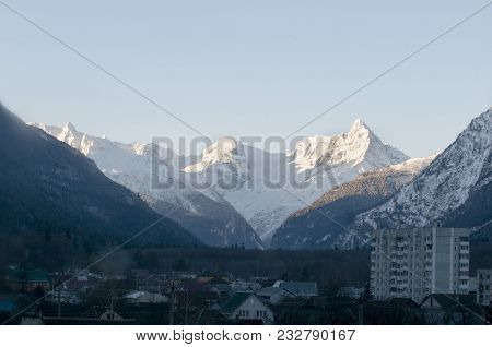 The Village Near The Mountain Peaks. Dombay Rocky Mountains