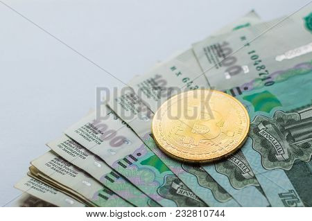 Bitcoin Crypto Currency Coin On Russia Ruble Banknotes.