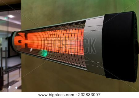 Heater Electric On The Cold Floor Winter Device. Heating The Room In The Cold Winter. Warm Bright Ha