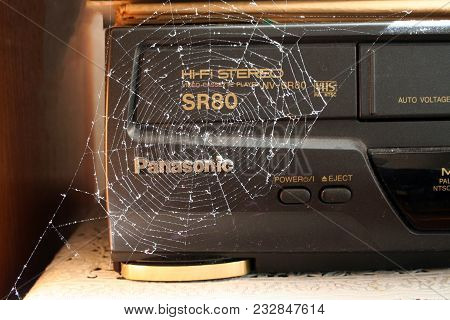 Kiev, Ukraine - 27.09.2005. Old Cassette Video Recorder In A Spiderweb