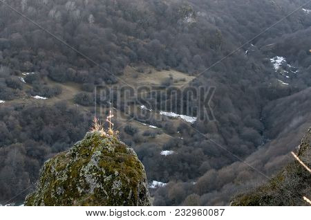 Beautiful Old Cross In Mountain Burial. The Mountainous Landscape Of The North Caucasus