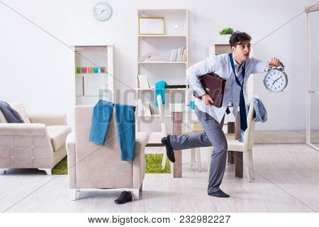 Businessman late for office due to oversleeping after overnight working