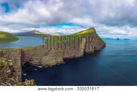 Panorama Of The Cliff Traelanipan And Lake Sorvagsvatn Located On The Island Of Vagar. Leitisvatn Or