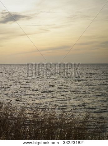 Beautiful View Of Sunrise Over Vistula Lagoon. Coast Close Frombork City.
