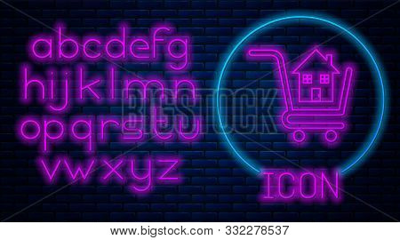 Glowing Neon Shopping Cart With House Icon Isolated On Brick Wall Background. Buy House Concept. Hom