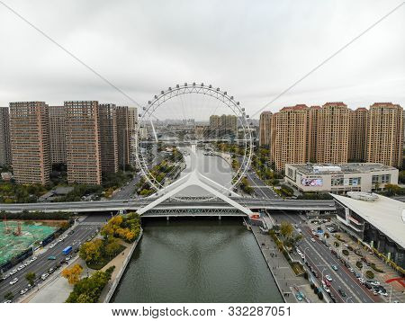 Aerial View Cityscape Of Tianjin Ferris Wheel. Famous Tianjin Eye Ferris Wheel Above The Yongle Brid