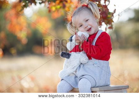 Little Fashionista. Happy Girl On Autumn Day. Little Girl Happy Smiling With Autumn Leaves. Girls Au