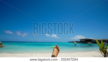 Feet Tourist Relax At Maldives Turquoise Sea White Sand Tropical Beach Paeadise