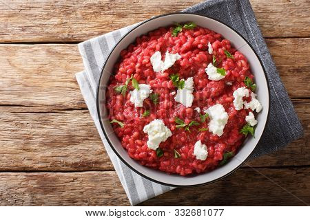 Healthy Orzotto Cooked From Pearl Barley With Beets And Goat Cheese Close-up On A Plate. Horizontal