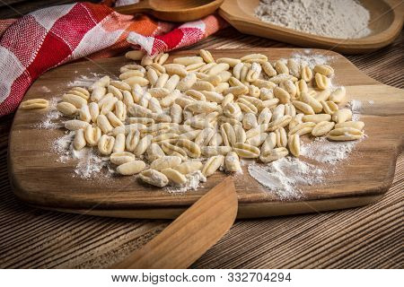 Cavatelli Pasta On Wooden Cutting Board. Italian Cuisine.