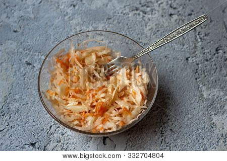 Homemade Sauerkraut. Fermented Food. Sauerkraut With Carrots In A Bowl On A Concrete Gray Background