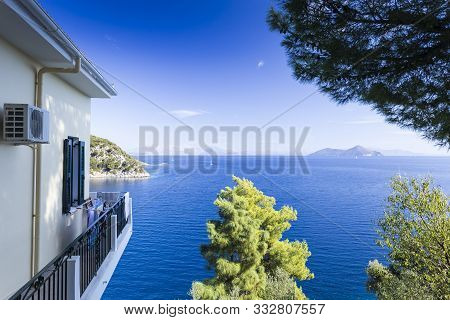 View Of The Sea And The Yacht, In The Foreground A House And A Tree, Sanny Weather