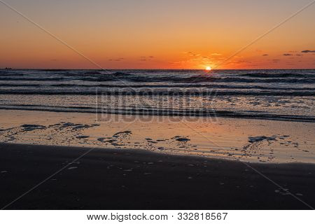 Beautiful Sunset Landscape At The North Sea And Orange Sky Above It With Awesome Sun Golden Reflecti