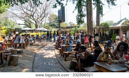 Johannesburg, South Africa - October 2019: Performer Singing On Stage In Fourways Farmers Market Wit