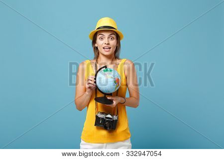 Traveler Tourist Woman In Yellow Summer Casual Clothes, Hat With Globe, Camera Isolated On Blue Back