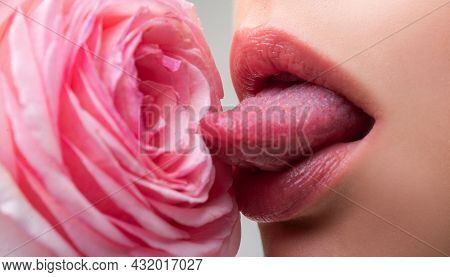 Lips With Tongue Closeup. Beautiful Woman Lips With Rose. Sexy Lips. Macro Of Womans Face Part. Sexy