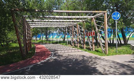 Cycle Lane-bike Path With A Wooden Fence With Signs, In Summer, Afternoon