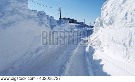 Road Full Of Snow On The Sides. Snow Covered Road In The Arctic