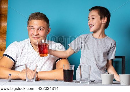 Chemistry Education And Training Concept. Close-up Of A Boy And His Dad, Scientists Are Doing Home E