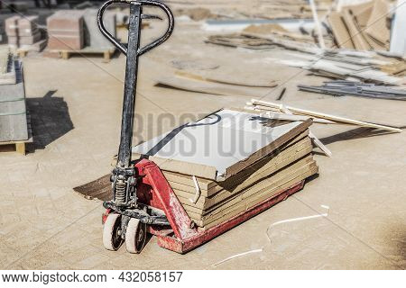 Warehouse Cart For Cargo Transportation. Industrial Trolley With Ceramic Tiles At A Construction Sit