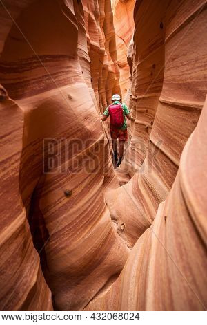 Slot canyon in Grand Staircase Escalante National park, Utah, USA. Unusual colorful sandstone formations in deserts of Utah are popular destination for hikers.