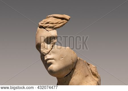 Closeup Portrait Of Antique Damaged Stone Bust Statue Depicting A Woman Head With Large Pieces Missi
