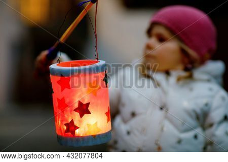 Close-up Of Little Kid Girl Holding Selfmade Lanterns With Candle For St. Martin Procession. Healthy