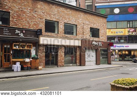 Old Brick Houses With Traditional Asian Cafes And Restaurants On The Street. Seoul, South Korea, 12-