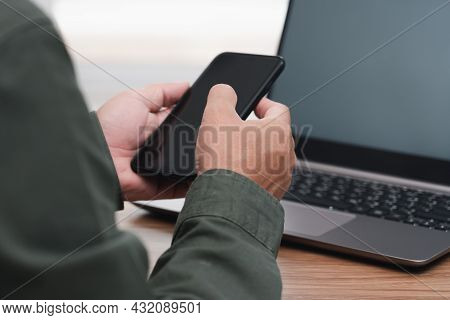 Business Man Holding Smartphone And Touch And Typing On Screen For Online Working And Use Desktop Co