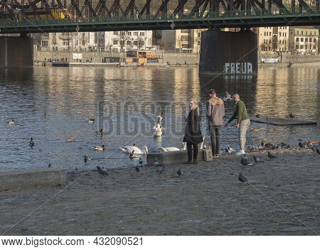 Prague, Czech Republic, March 26, 2021: The Embankment Of River Vltava Called Naplavka, With Crowd O