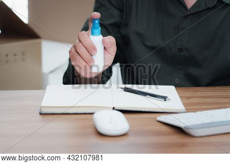 Close Up Hand A Man Holding Alcohol Spray Bottle Clean Product Before Packing Package Post Shipping 