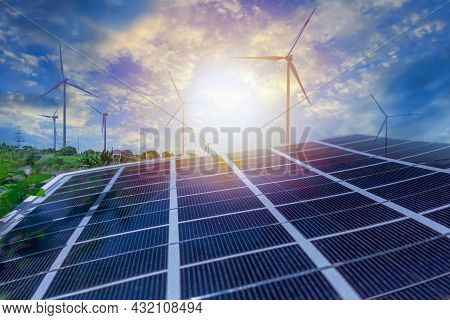 Solar Panels And Wind Power Stations. Renewable Energy Wind And Solar Generation. Defocused Photo Wi