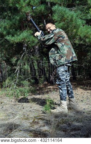 Mature man with KRISS Vector 9*21 caliber submachine gun in the forest. Unformal shooting range near Kiev. September 6,2021. Kiev Region, Ukraine