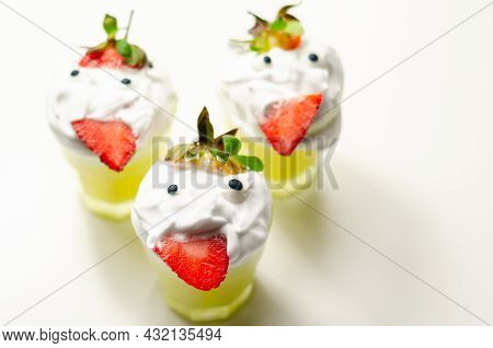 Egg Liqueur In Shot Glass Decorated With Fluffy Whipped Cream And Pieces Of Strawberry, Served In Fu