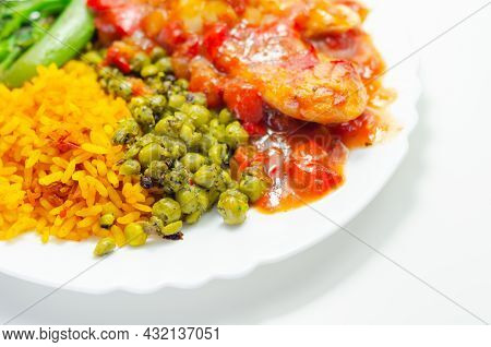 Chicken Breast In A Tomato And Red Pepper Sauce With Spiced Long Grain Rice And Crushed Minted Peas,